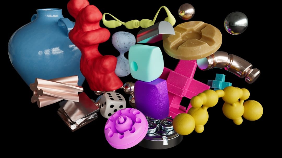 Assortment of colorful 3D abstract objects floating against black background