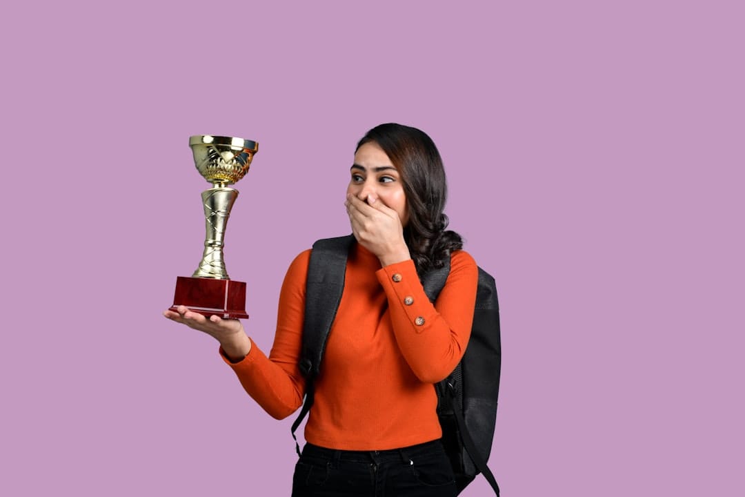 a woman holding a trophy