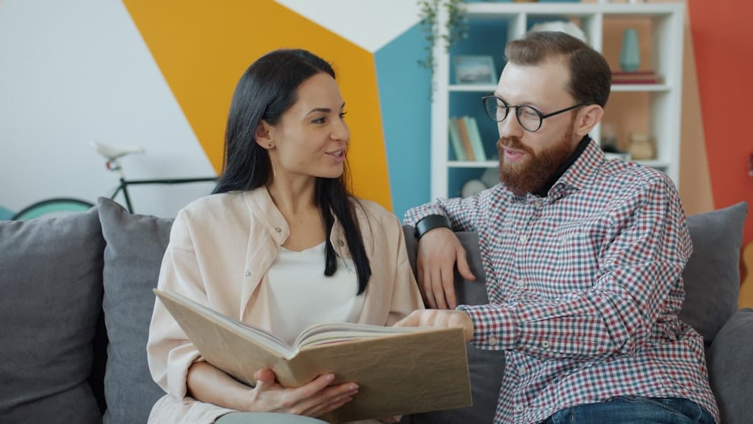 Couple looking at an open photo album together