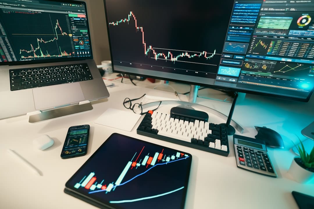 Stock charts are displayed on multiple screens.
